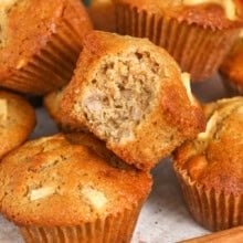 plate of cinnamon Apple Muffins with a bite taken out of one