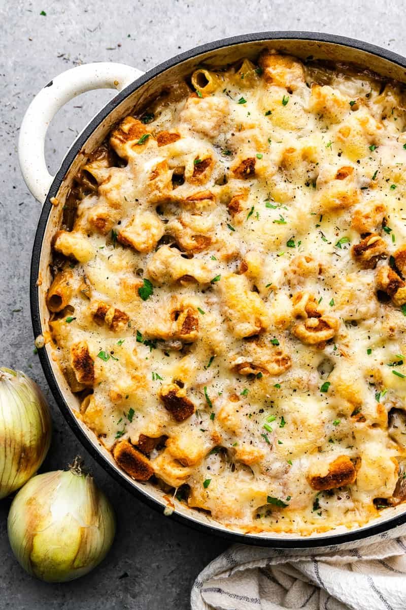 An overhead close up view of a pot of French onion pasta casserole.