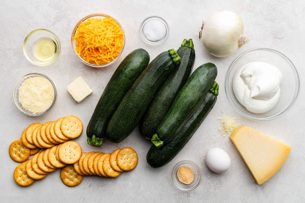 An image of raw, fresh and dry ingredients to use in zucchini casserole.