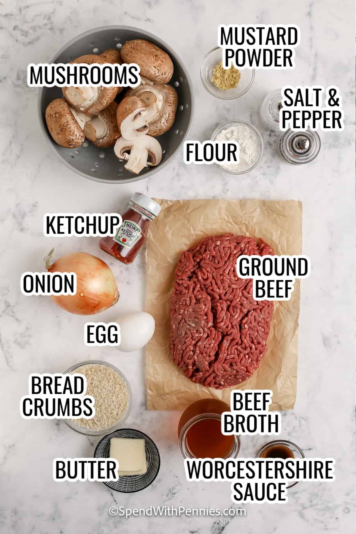 ingredients assembled to make mushroom salisbury steak, including mushroom, ground beef, onion, egg, bread crumbs, butter, ketchup, beef broth, and worcestershire sauce