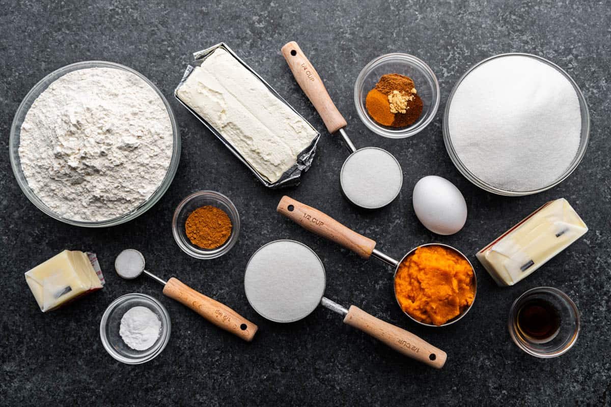 An overhead view of the ingredients needed to make pumpkin cheesecake thumbprint cookies.