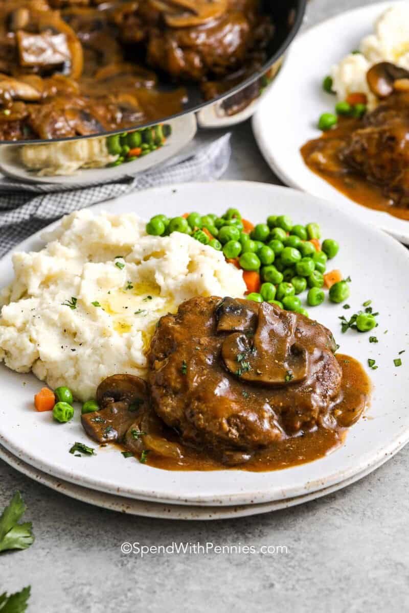 salisbury steak on a plate with mashed potatoes