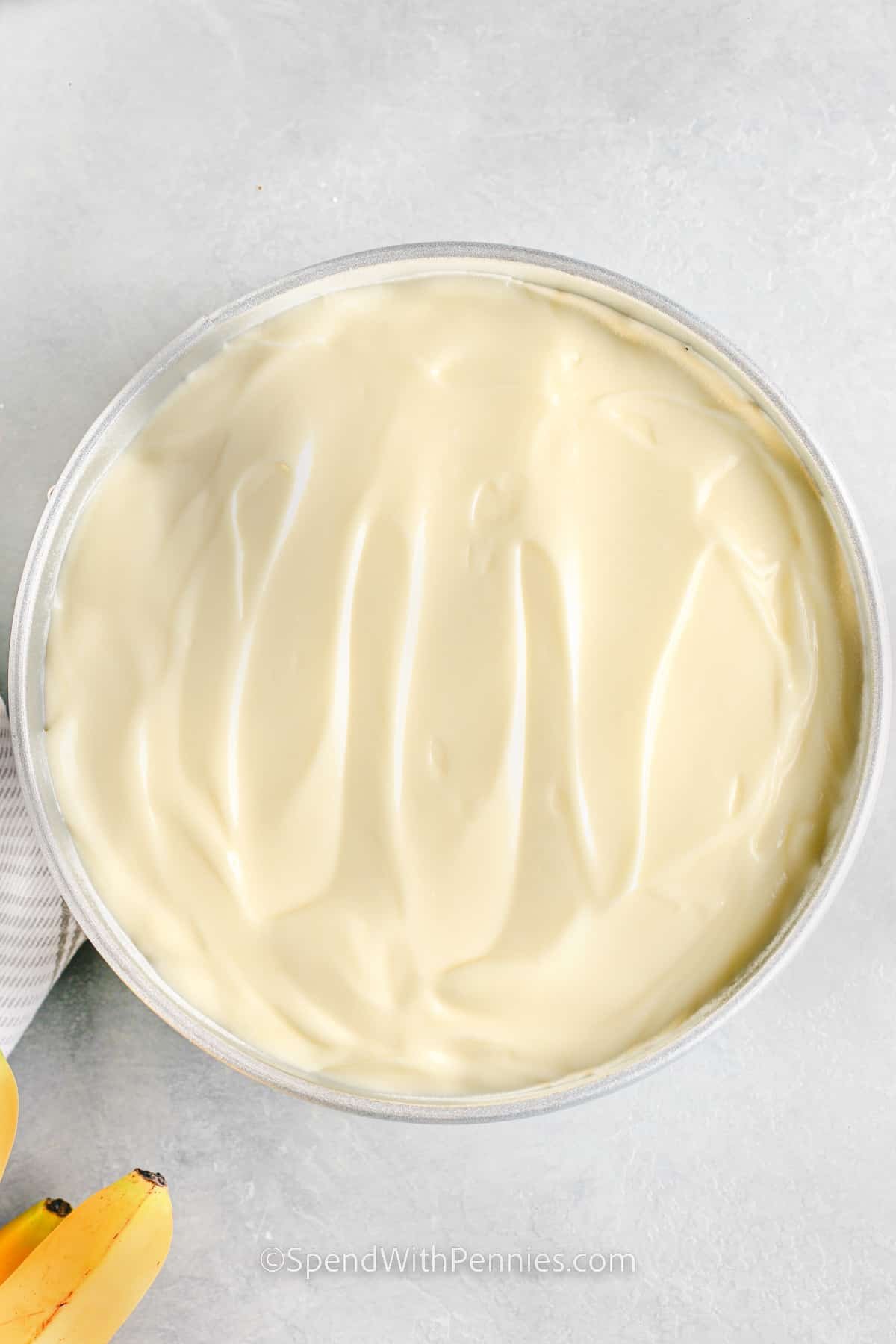 pudding mixture in a glass bowl for banana pudding cheesecake