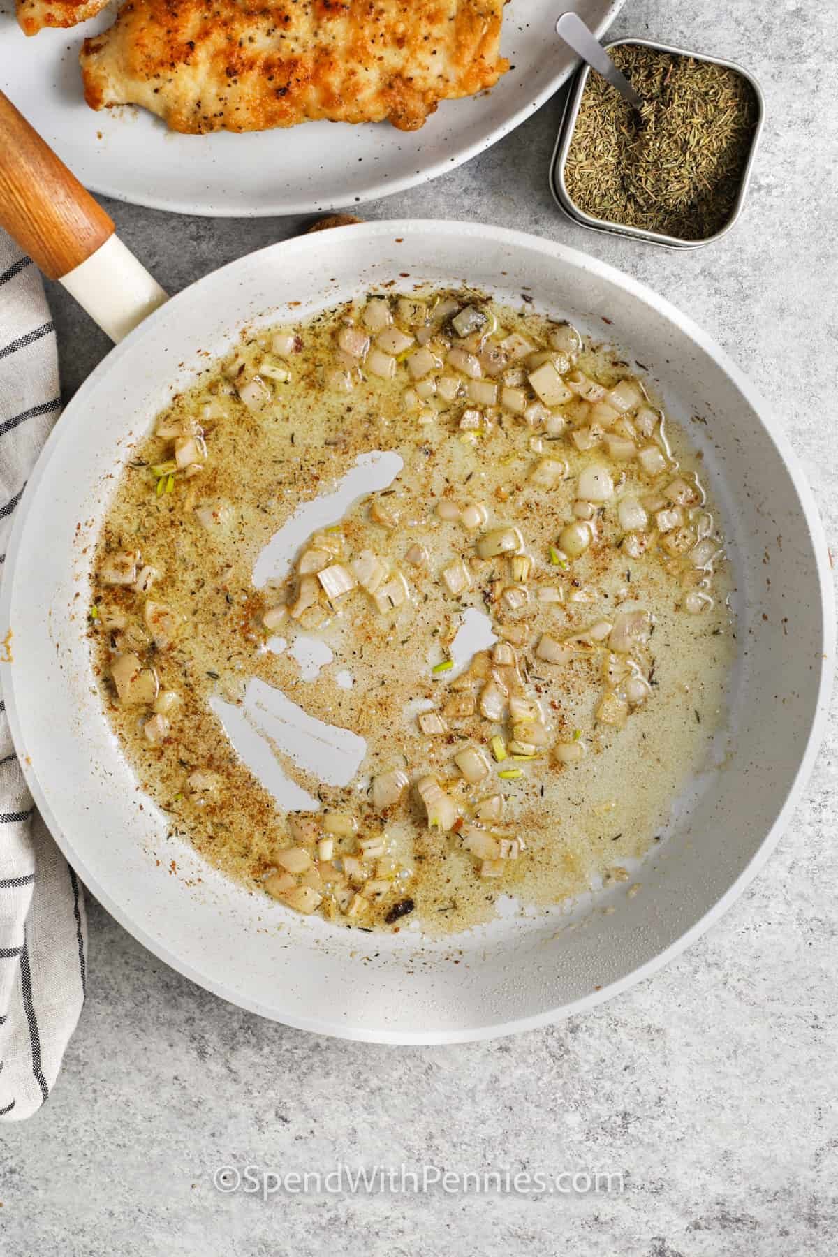 cooking onions to make Chicken Marsala