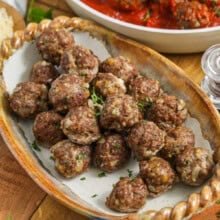 Easy Meatball Recipe on a plate and in a pan with sauce