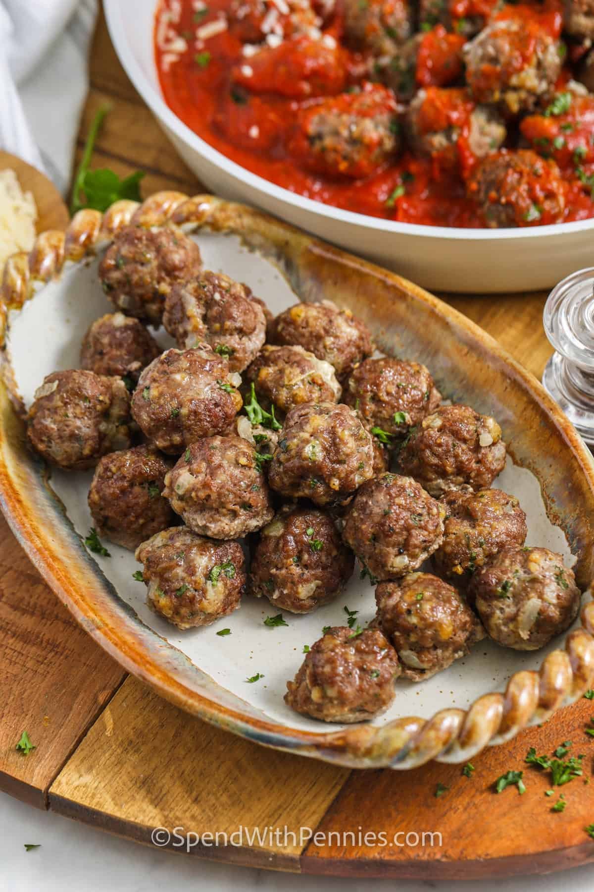 Easy Meatball Recipe on a plate and in a pan with sauce