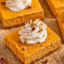 Pumpkin Cheesecake Bars with whipped cream