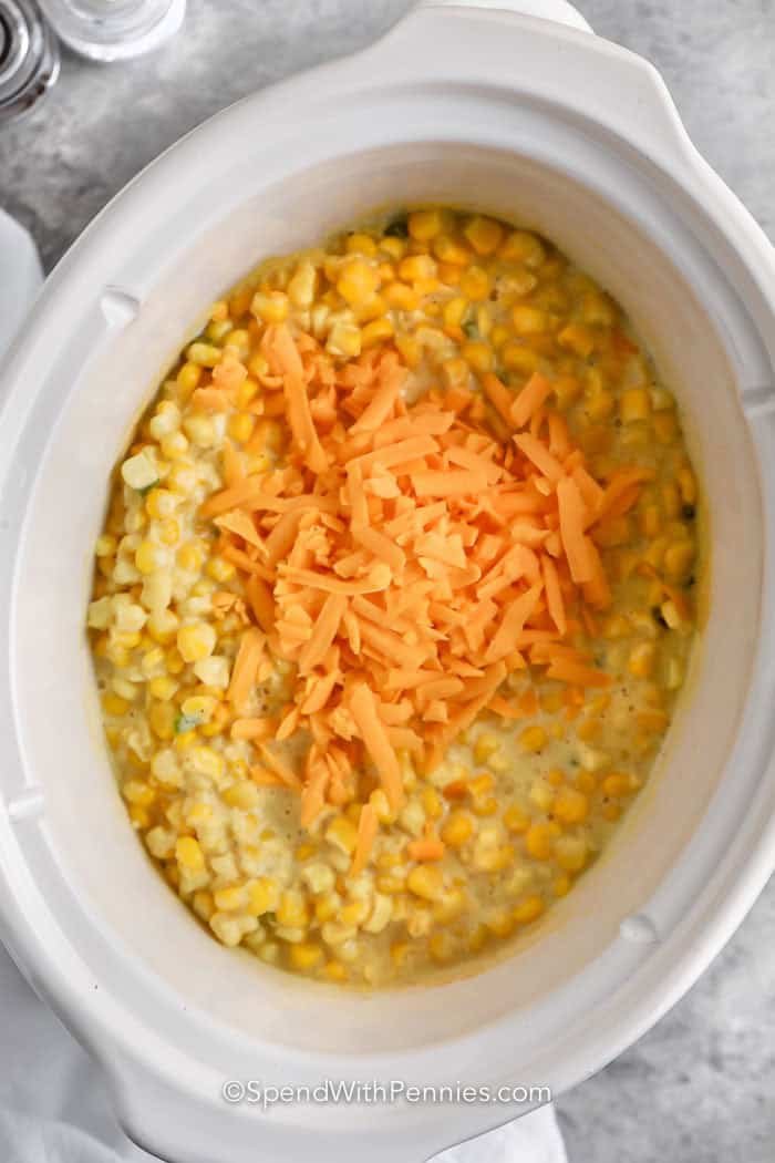 adding cheese to Crock Pot Creamed Corn