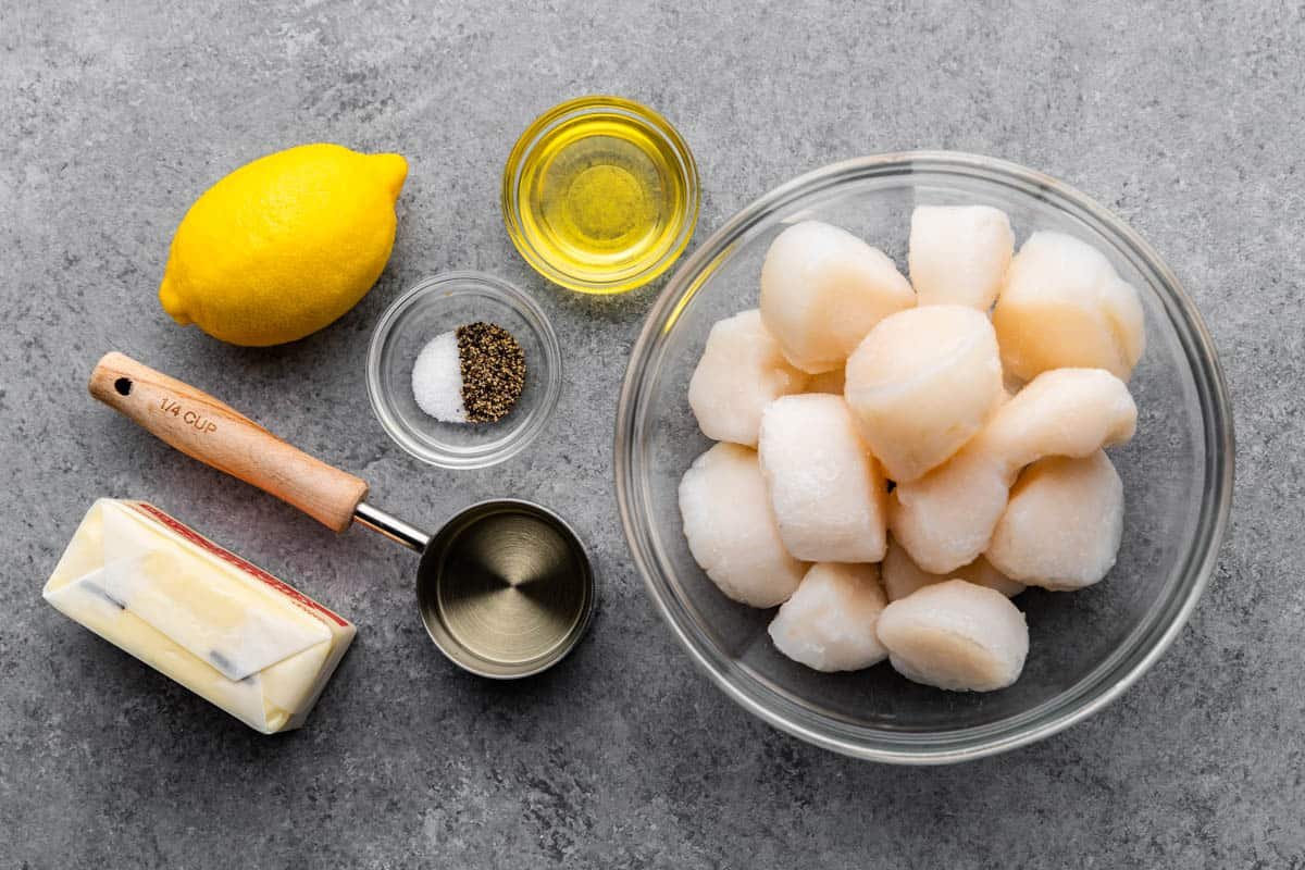 An overhead view of the ingredients needed to make lemon garlic scallops.