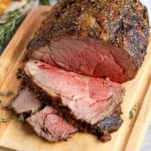 Prime Rib cooked on a cutting board cut into slices